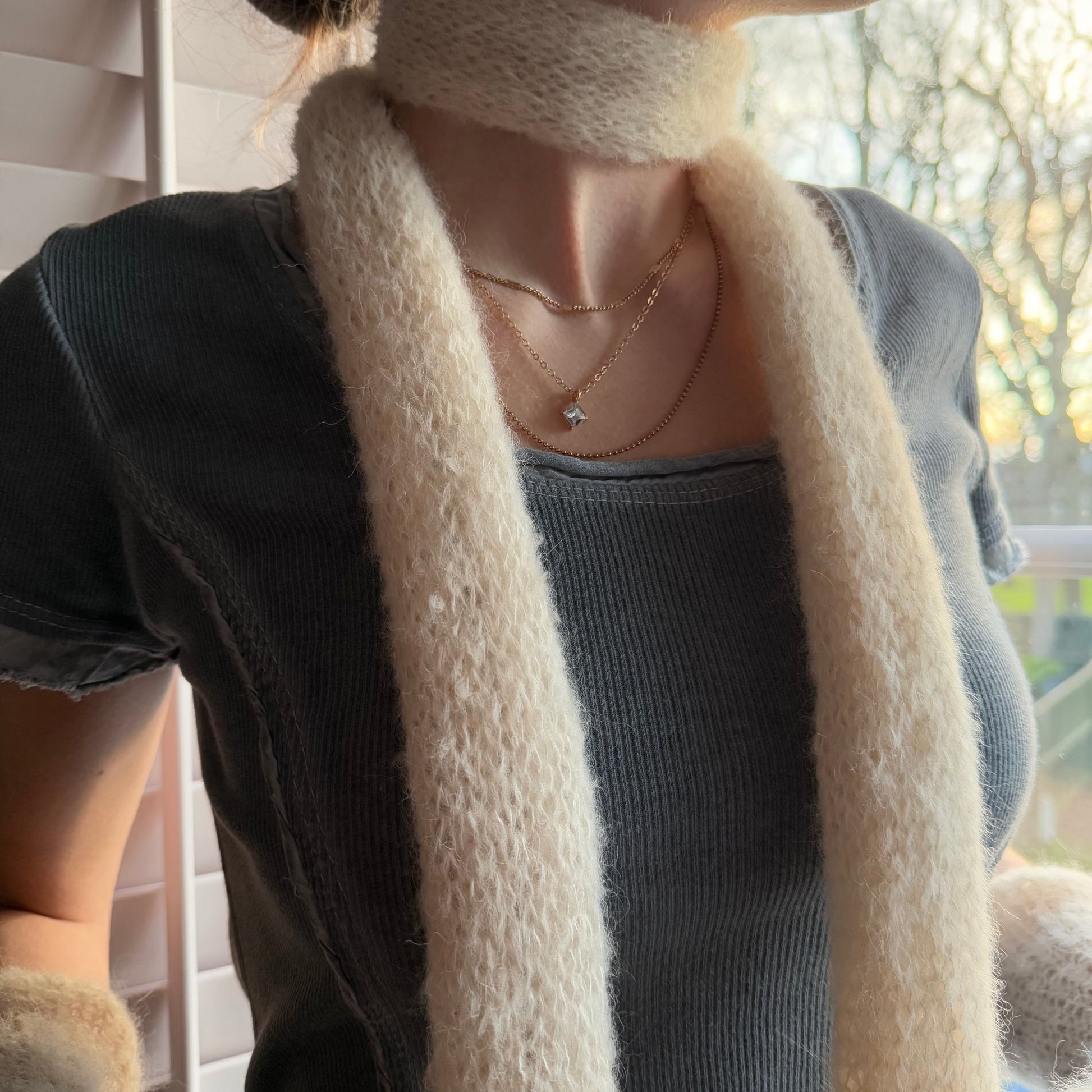 knitted cream scarf close up
