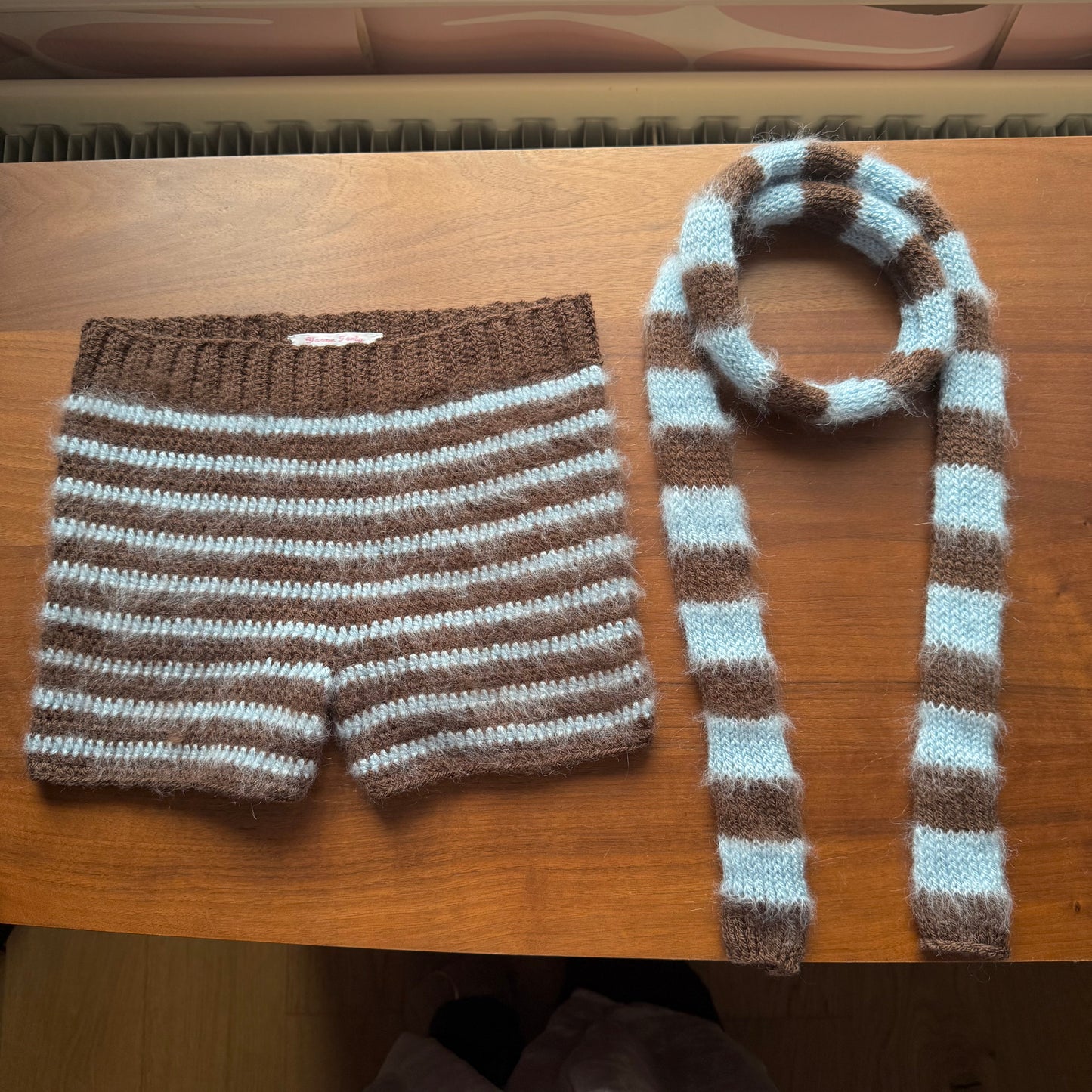 brown and baby blue striped knitted scarf flatly pic