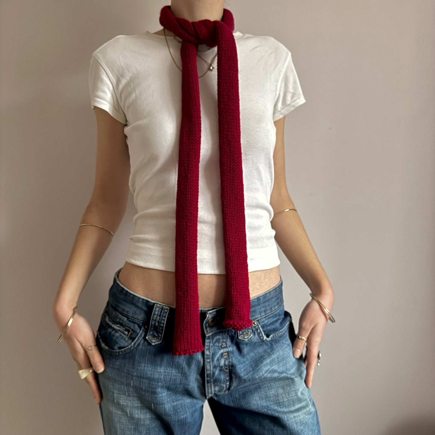 Handmade knitted skinny scarf in dark red