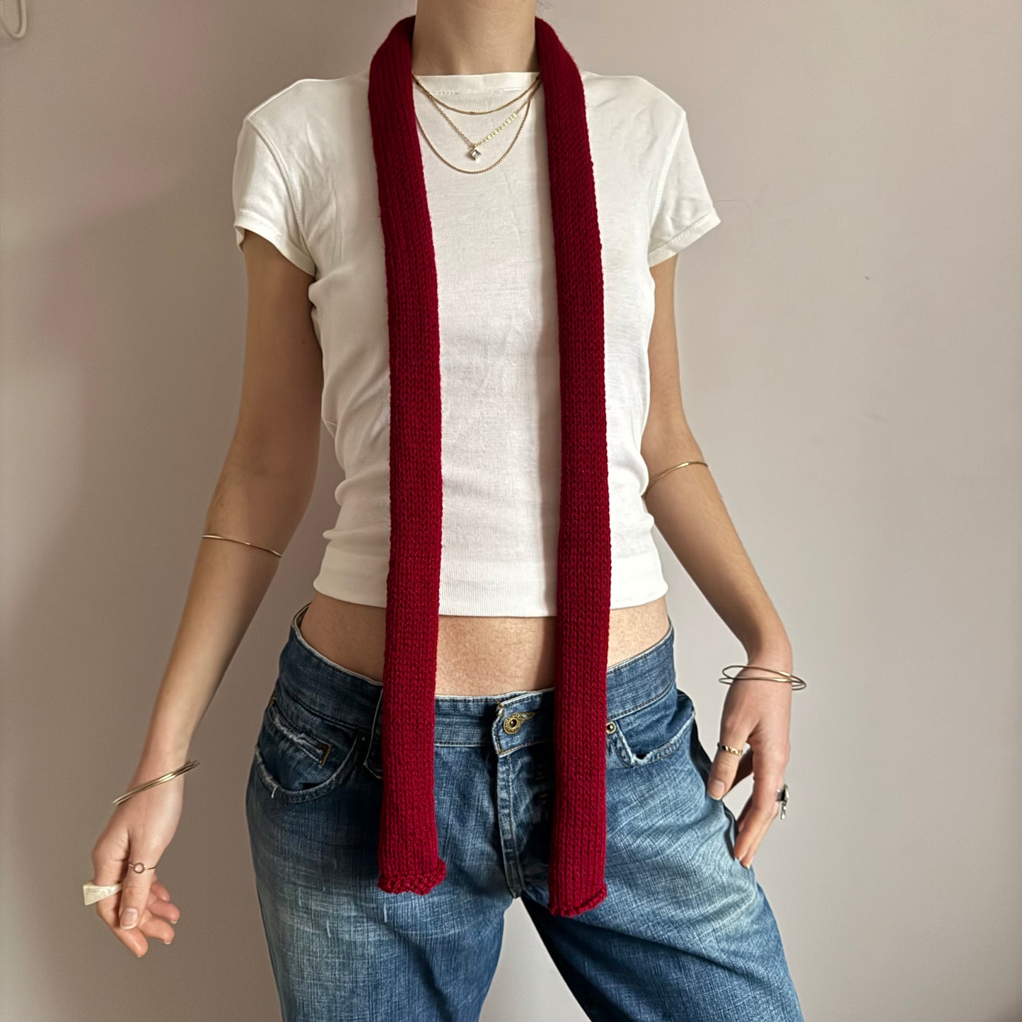 Handmade knitted skinny scarf in dark red