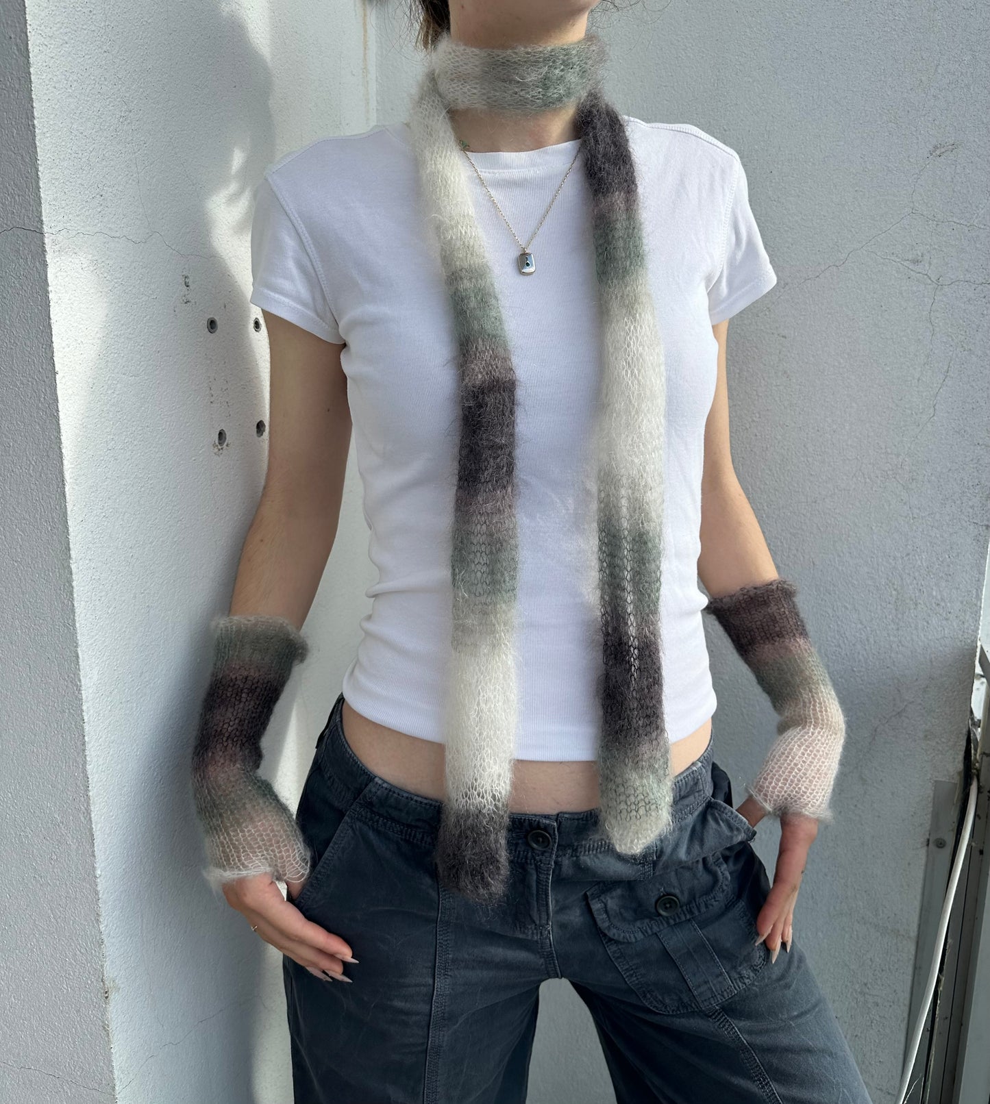 Handmade knitted mohair hand warmers in ombré black, grey and white