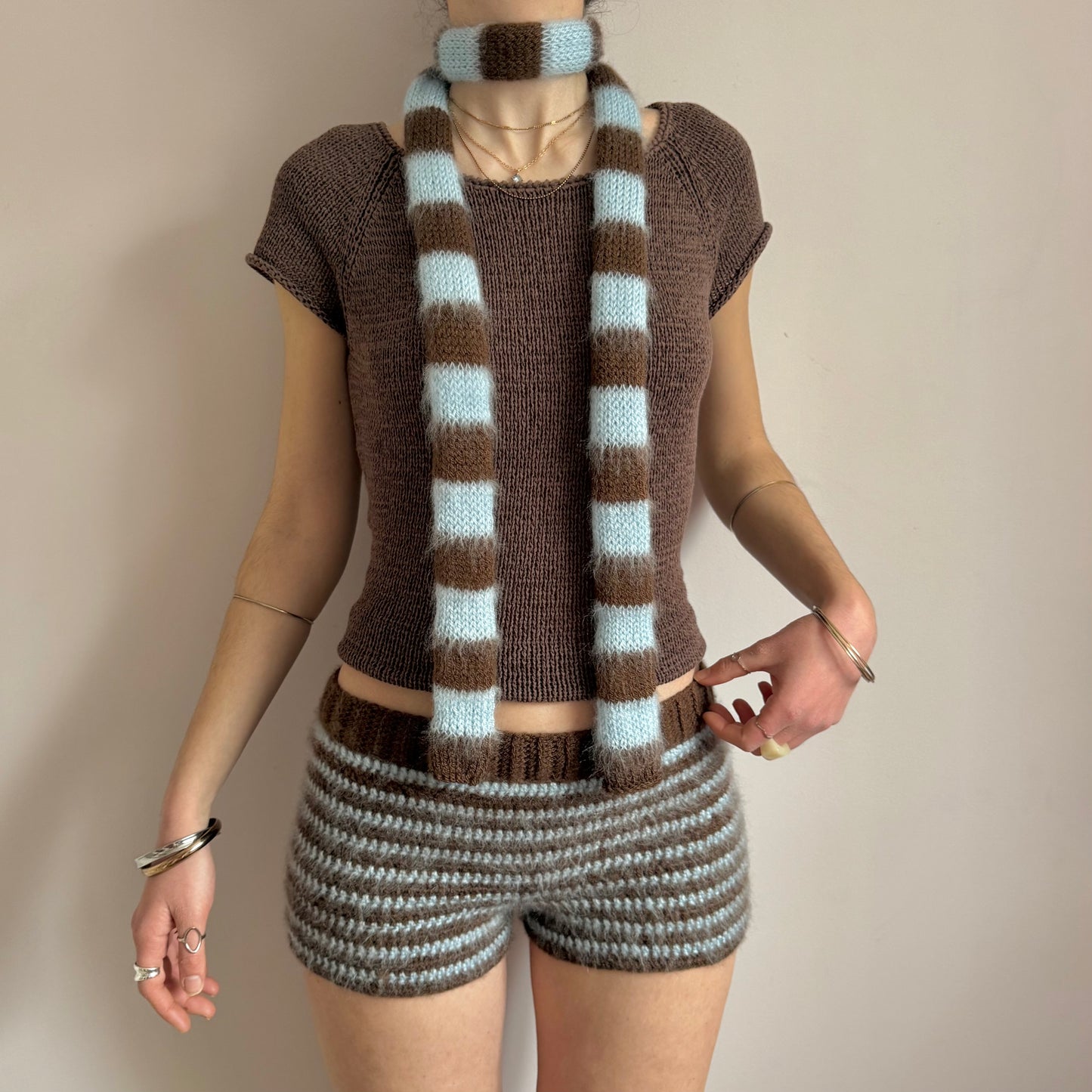 stripy baby blue and brown skinny scarf modelled with matching shorts
