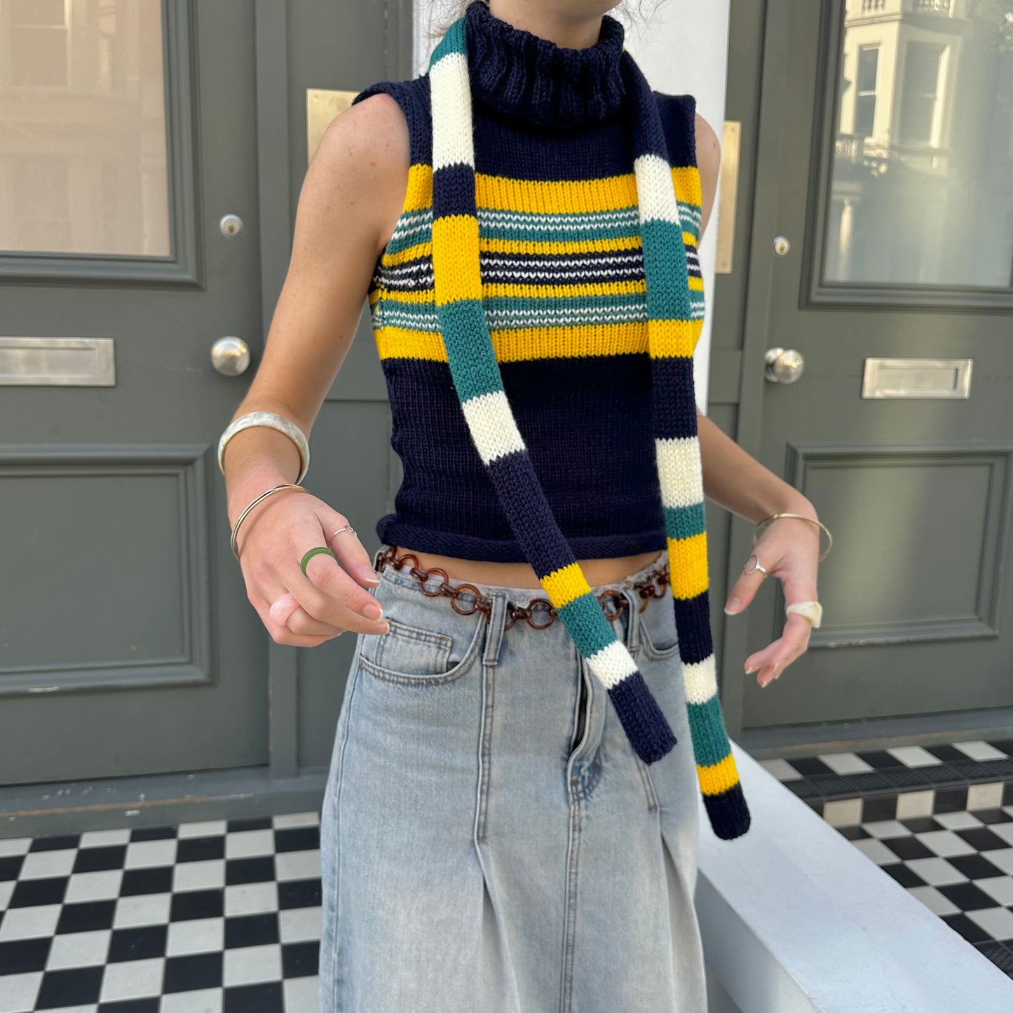 Handmade knitted stripy skinny scarf in navy, cream, yellow and teal