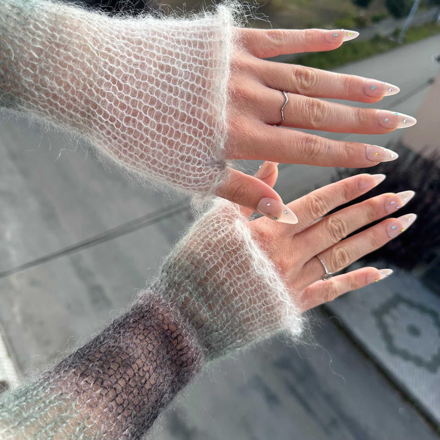 Handmade knitted mohair hand warmers in ombré black, grey and white