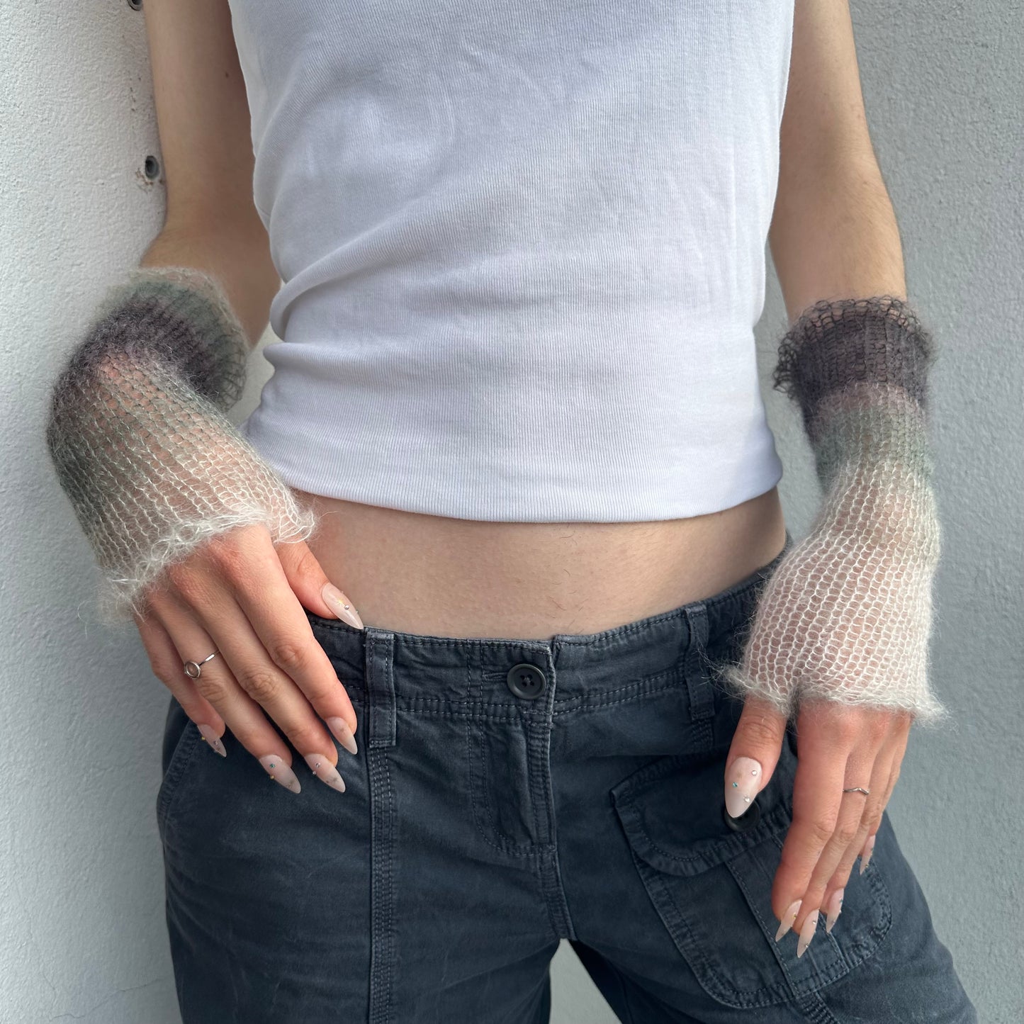 Handmade knitted mohair hand warmers in ombré black, grey and white