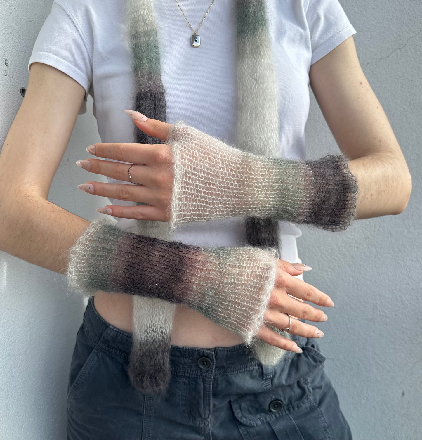 Handmade knitted mohair hand warmers in ombré black, grey and white