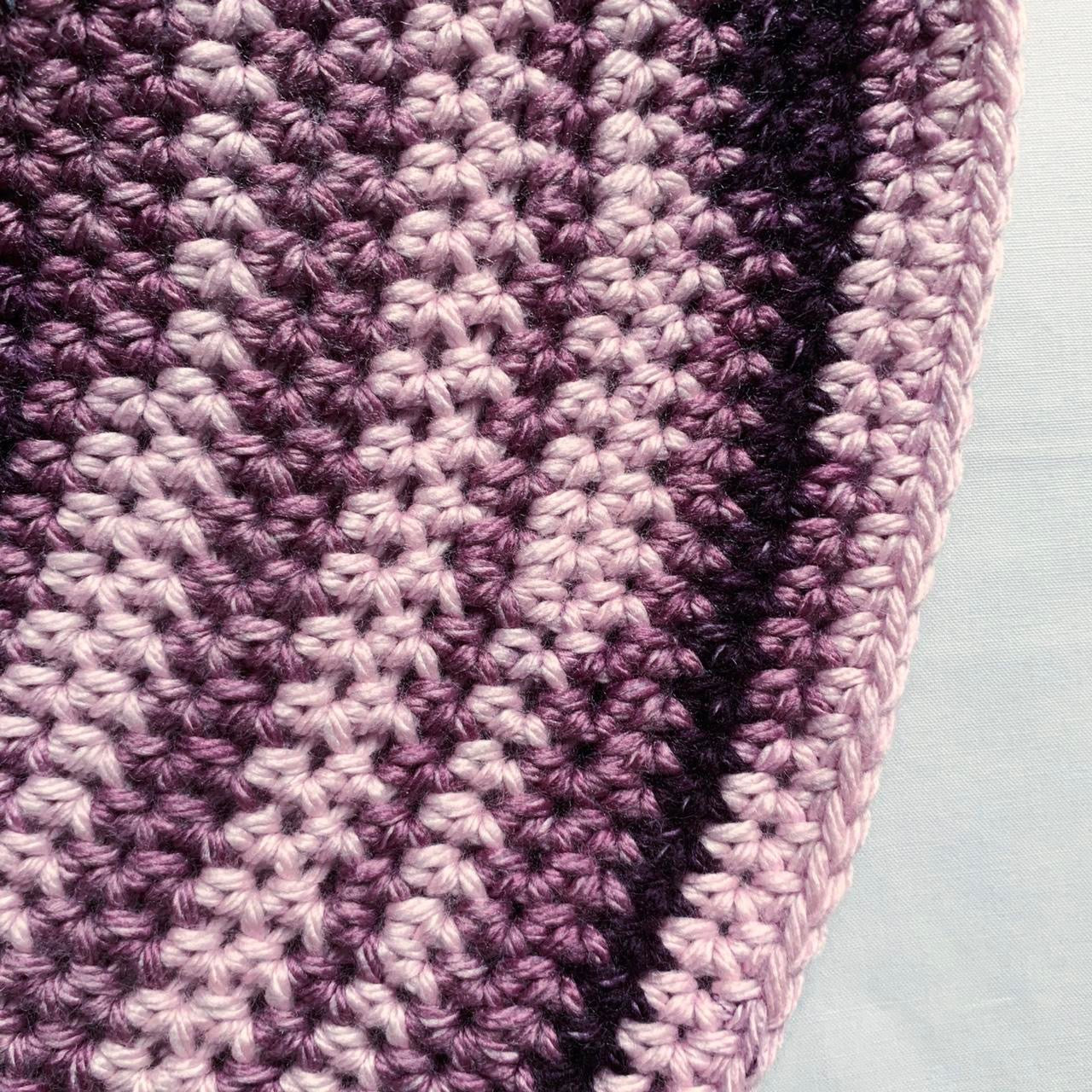 Handmade striped crochet bucket hat in purple shades
